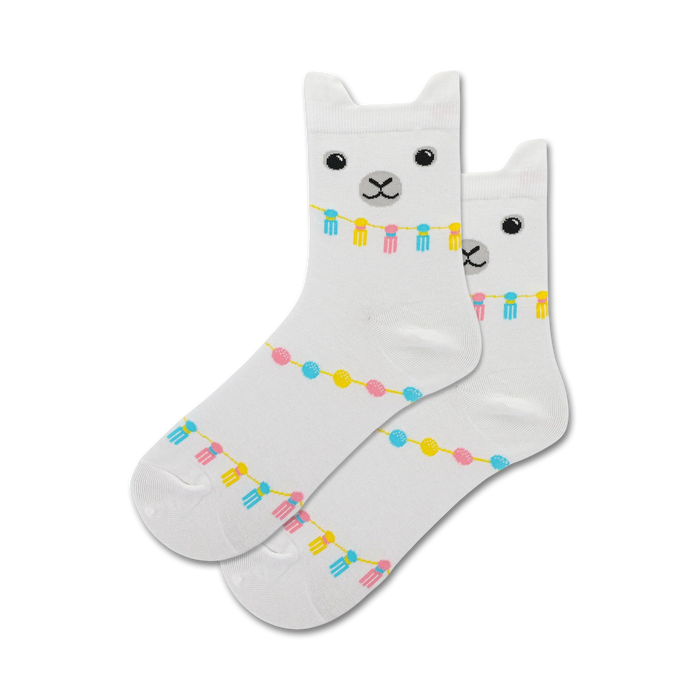 Pair of white crew socks featuring a llama face and pastel-colored tassels and beads.  }}