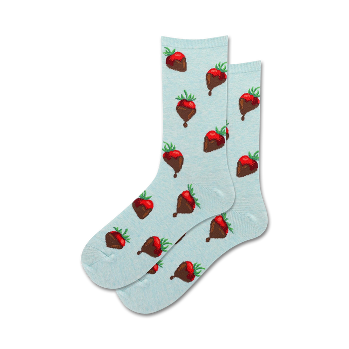 Lifestyle shot showing a pair of light blue crew socks with a chocolate-covered strawberry pattern.