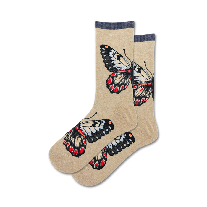 butterfly socks in crew length, light tan color, pattern of red, black, white, and blue butterflies, women's sizes.    