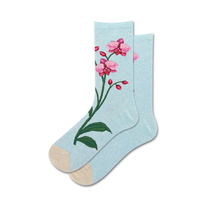 Pair of women's crew socks in light blue featuring embroidered pink orchids.  Beige heel and toe.