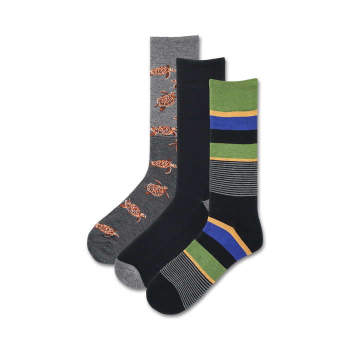 Three crew socks: one gray with orange turtles, one black with gray stripes, and one black with green, gray, and blue stripes. }}
