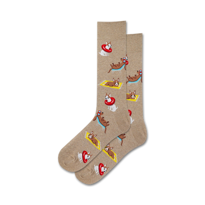 Pair of tan crew socks with a repeating pattern of cartoon dogs lounging on beach towels and in inflatable rings.