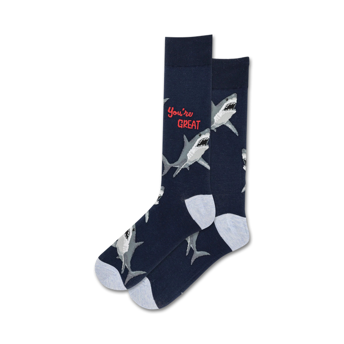 Pair of crew socks; navy blue with white great white sharks and red 'You're Great' text.