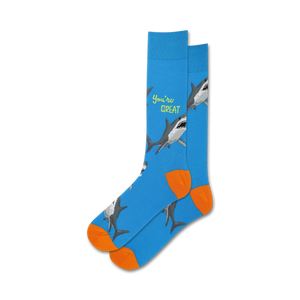 Lifestyle shot showing the blue 'You're Great' socks with orange cuffs on a person's feet.