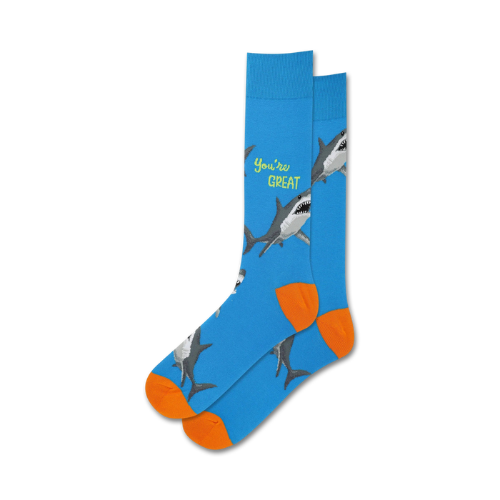 Lifestyle shot showing the blue 'You're Great' socks with orange cuffs on a person's feet.
