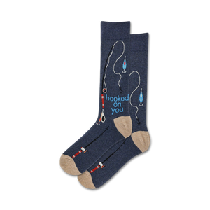 Pair of crew socks in navy blue and beige, featuring a fishing-themed design with fishing rods, hooks, and lures, and the text 'hooked on you'.