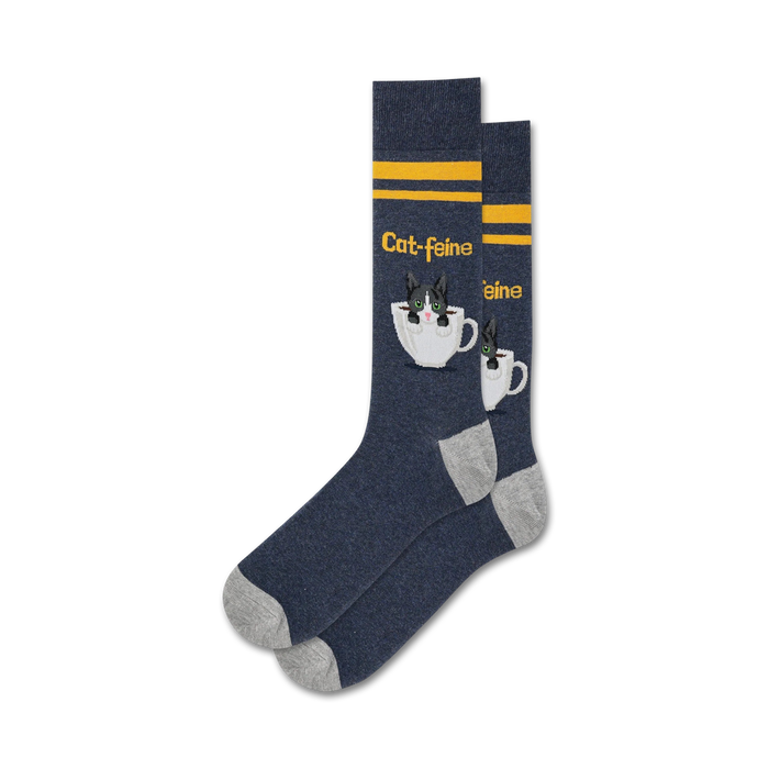 Pair of navy blue crew socks with grey cuffs. Features a cute tuxedo cat in a coffee cup design and yellow stripes.