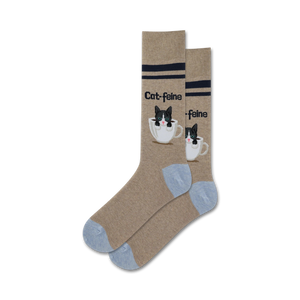 brown crew socks with blue toes and heels. black and white cat pattern on a white coffee cup with â€œcat-feineâ€ text.   