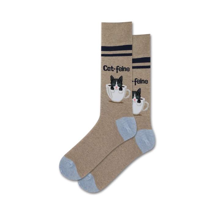 brown crew socks with blue toes and heels. black and white cat pattern on a white coffee cup with â€œcat-feineâ€ text.   