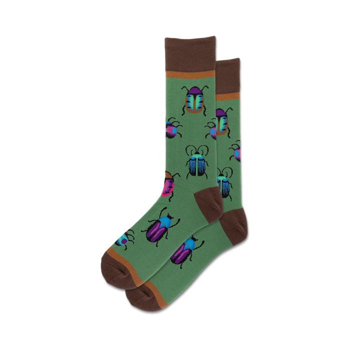 Pair of crew socks with a green background and colorful beetle designs. Brown cuff. Fun and quirky.
