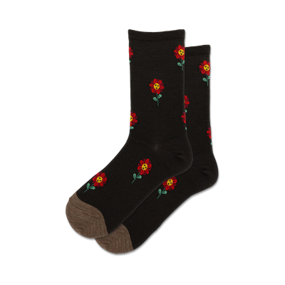 Pair of dark wool socks with a red flower pattern. The socks are crew length and have a taupe-colored heel and toe.