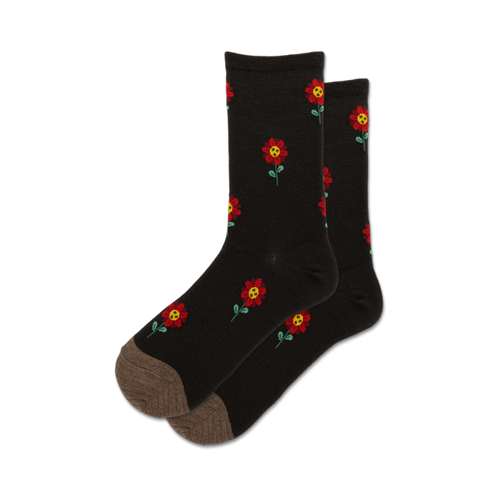 Pair of dark wool socks with a red flower pattern. The socks are crew length and have a taupe-colored heel and toe. }}