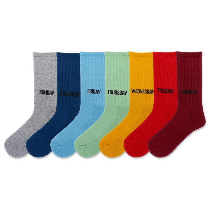 Seven crew socks in a rainbow of colors: gray, navy, light blue, light green, yellow, red, burgundy. Each sock has a day of the week printed on it. }}