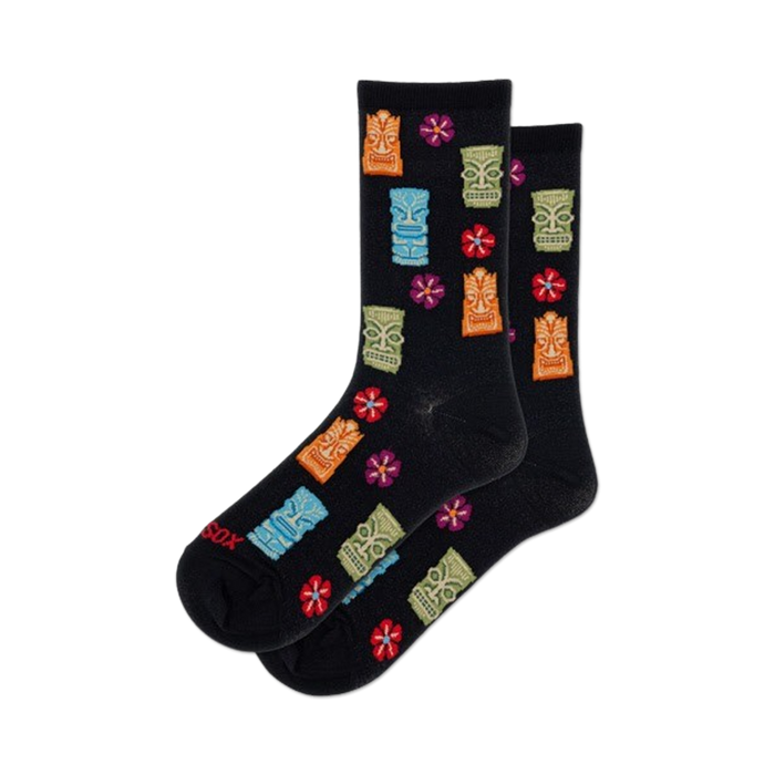 Pair of black crew socks with colorful tiki idols and red flowers. Fun, tropical design. }}