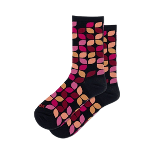 Lifestyle shot showing the navy Leafy Geo socks on a model's feet. The socks are slightly rolled to show off the cuff.