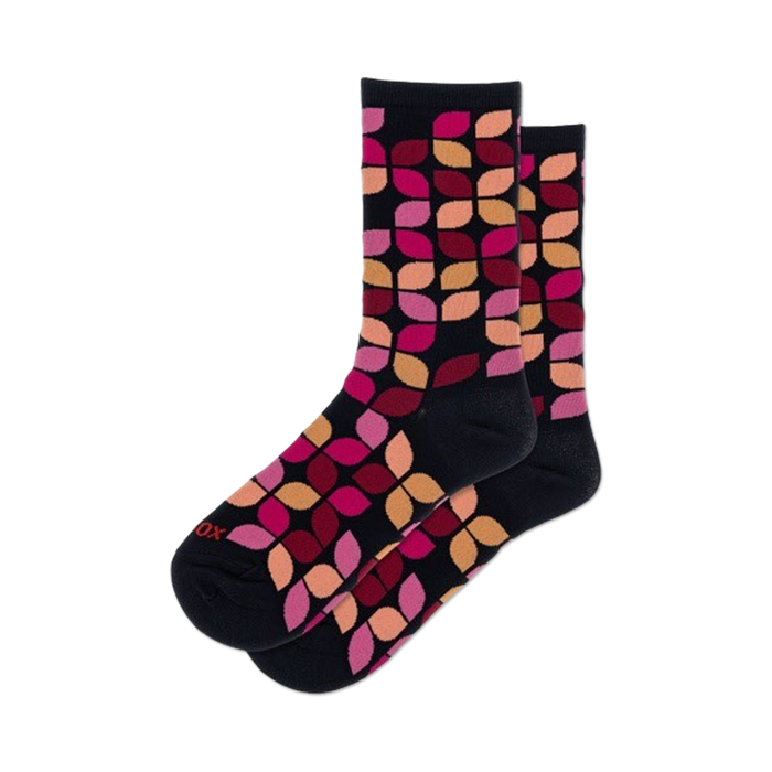 Lifestyle shot showing the navy Leafy Geo socks on a model's feet. The socks are slightly rolled to show off the cuff.