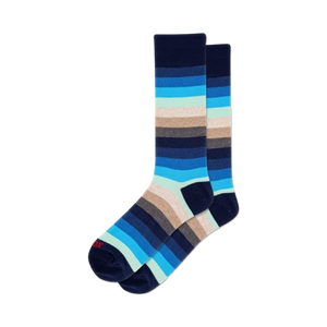 Pair of blue ombre stripe crew socks. Features horizontal stripes in shades of navy, light blue, and beige.
