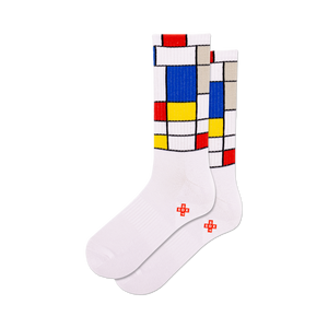 Pair of white crew socks with a colorful Mondrian-inspired geometric design. Red, yellow, and blue squares on a white background.