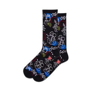 Pair of black crew socks with a whimsical design featuring abstract faces, floral elements, geometric shapes, and pops of blue and green.
