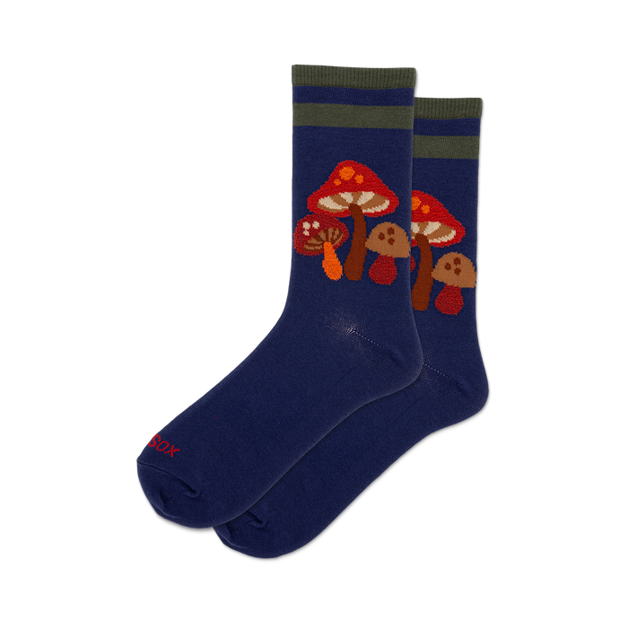Pair of navy blue crew socks with a whimsical mushroom design. Features orange and brown mushrooms and olive green stripes near the cuff. }}