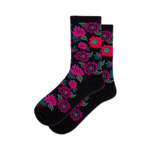 Pair of black crew socks with a colorful floral pattern featuring pinks, purples, and reds.
