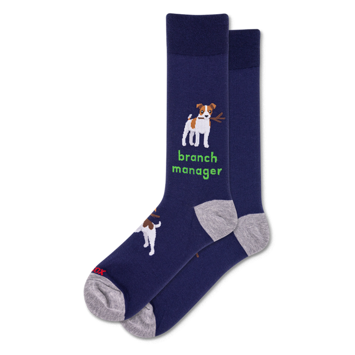 Pair of navy crew socks. One sock features a white and brown dog holding a stick with