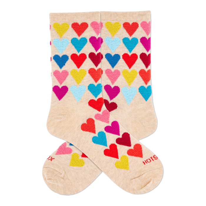 Two cream crew socks with a repeating pattern of colorful, fuzzy hearts in red, yellow, light blue, dark blue, magenta. }}