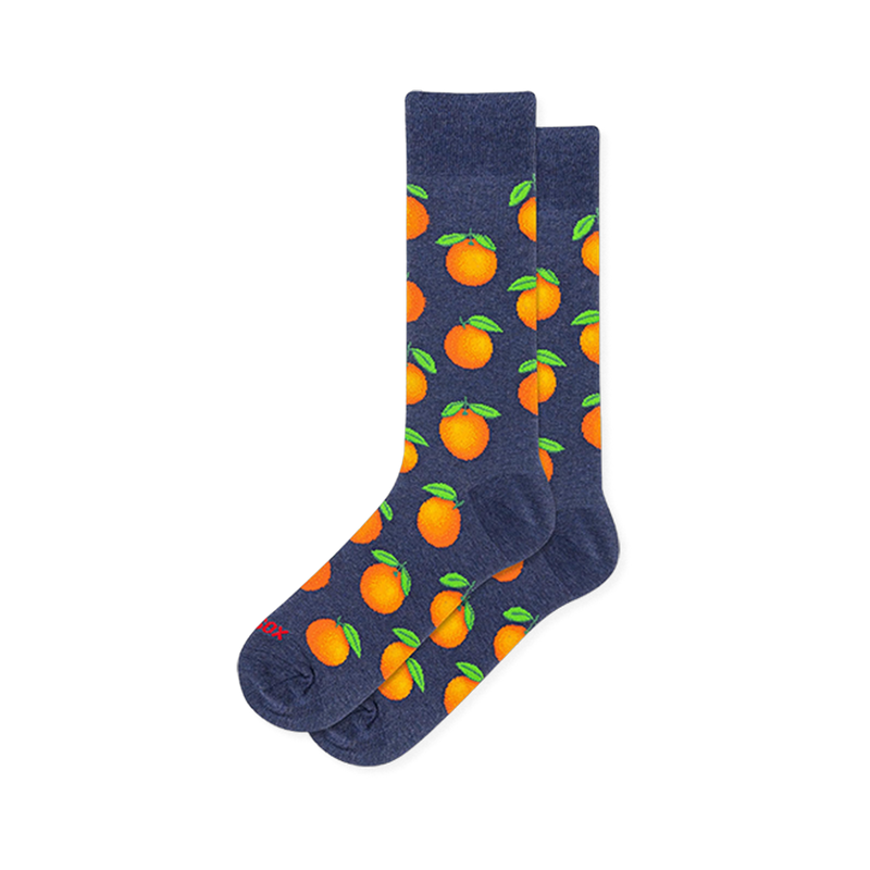 Heather navy blue crew socks covered in a repeating pattern of bright whole oranges with vivid green leaves.