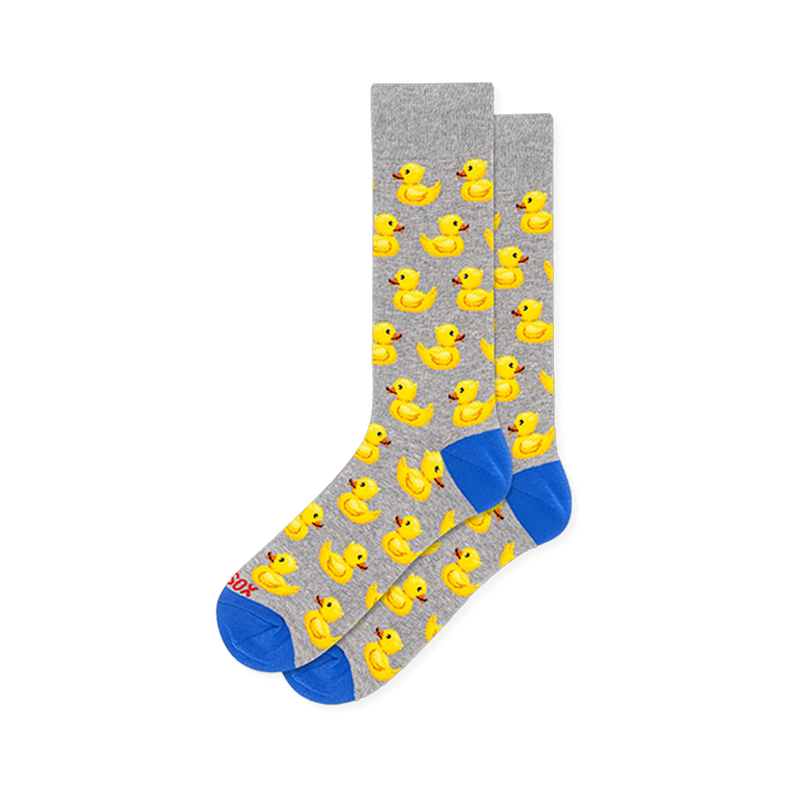 Light grey crew socks showing a repeating yellow rubber duck pattern with bright blue accents on the toes and heels.
