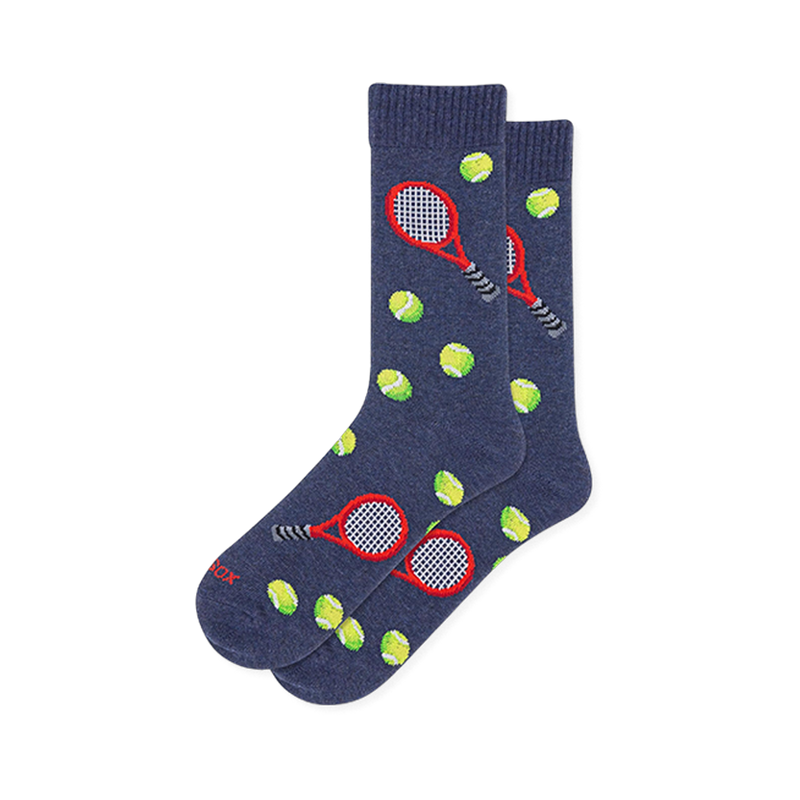 Heather navy blue socks featuring a pattern of red tennis rackets with dark handles and bright yellow-green tennis balls.