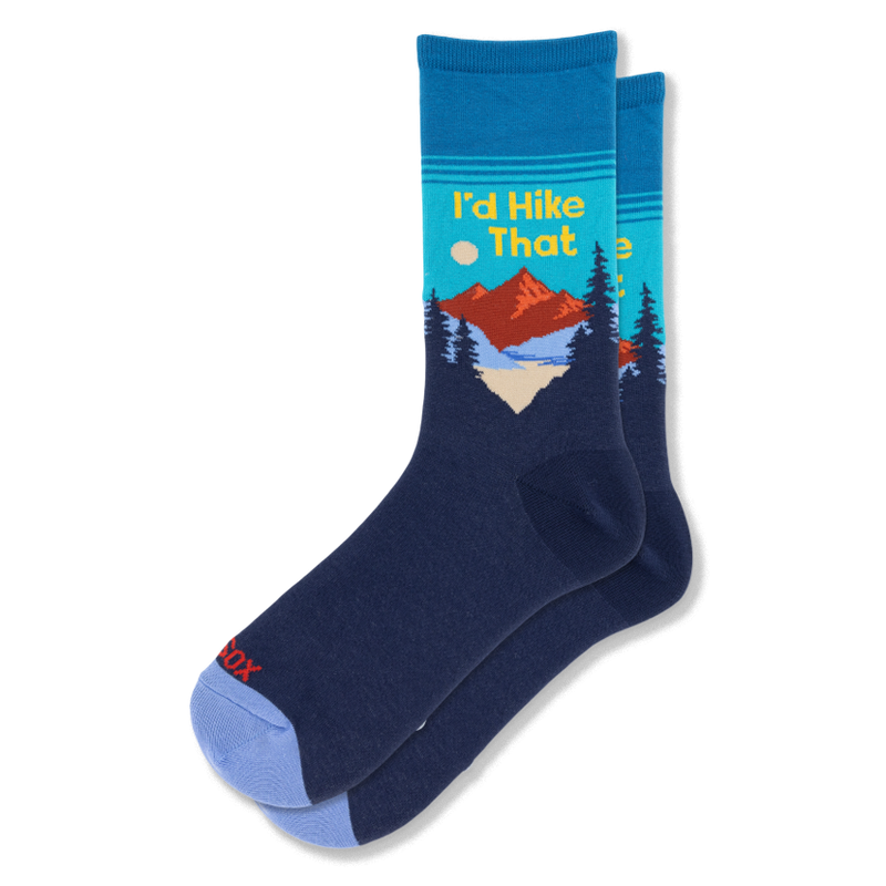 Navy and teal crew socks with a red mountain, dark pine trees, and yellow text reading I'd Hike That. Features a blue toe.