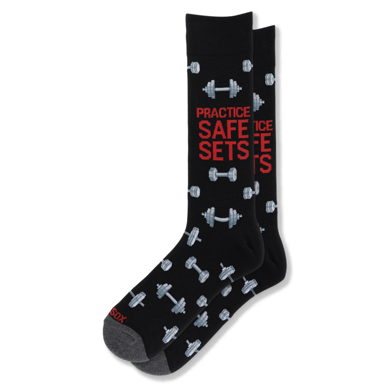 Black crew socks featuring grey dumbbells and bold red text reading PRACTICE SAFE SETS on the leg, with dark grey toes.