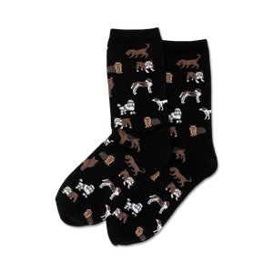 Pair of crew socks, black background, with a repeating pattern of various brown and white dogs.
