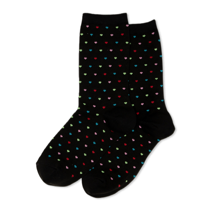 Pair of black crew socks with a repeating pattern of small, colorful pindot hearts in red, green, blue, and pink.