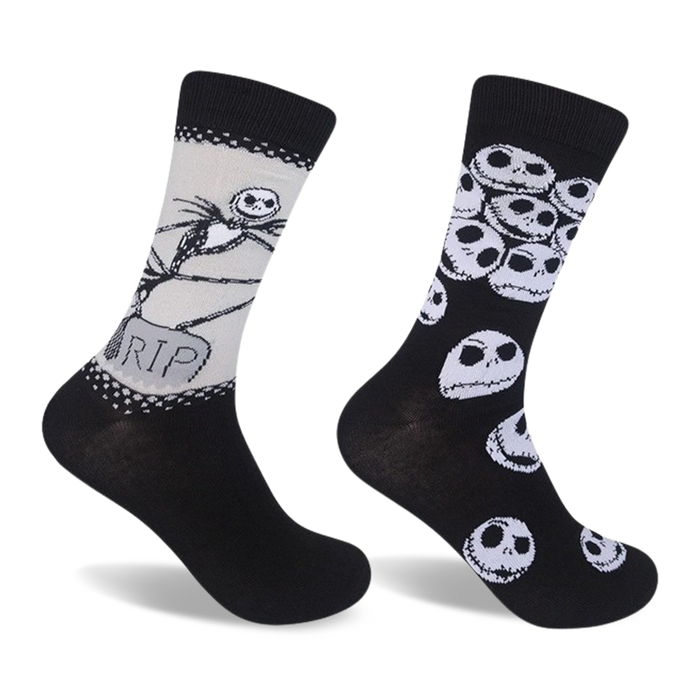 Two crew socks. One sock features Jack Skellington and a tombstone; the other has a repeated pattern of Jack's skull. Both are black and white. }}