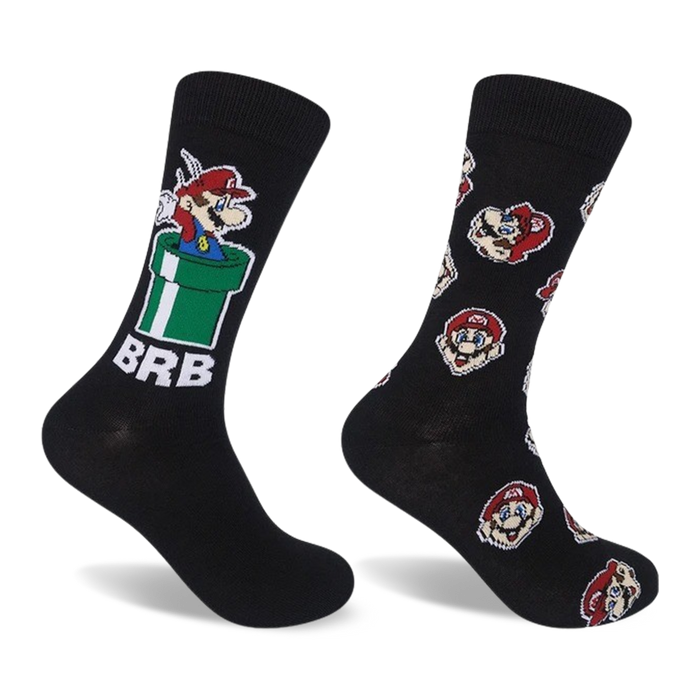 Two black crew socks. One features Mario in a green pipe, the other has repeating Mario head designs. Both socks have red and white accents. }}