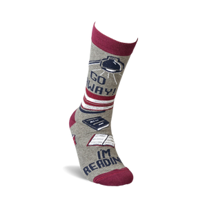 Single grey crew sock with burgundy cuff, showing the full design detail of books and lamp, 'Go Away!' and 'I'm Reading'.