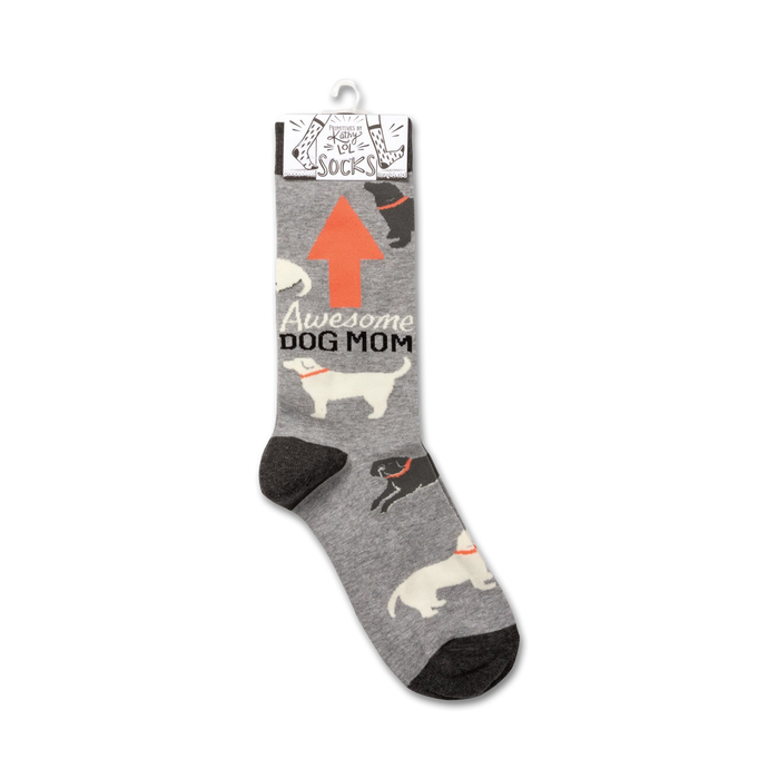 Product shot of 'Awesome Dog Mom' socks hanging on a retail display card.