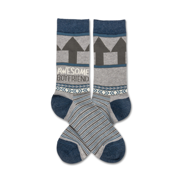 Pair of gray and blue crew socks.  Features gray arrows, the words
