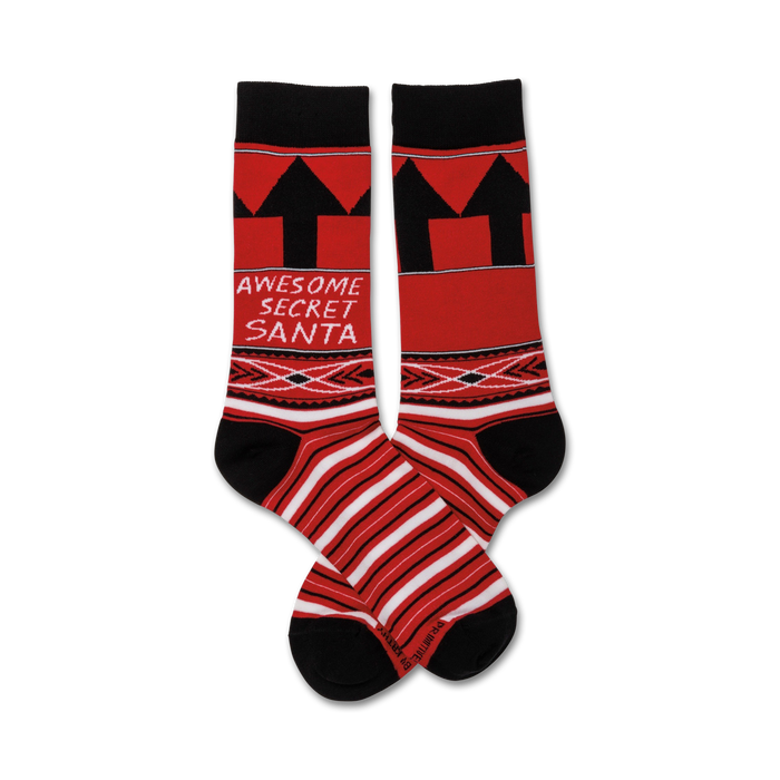 Pair of crew socks in red and black.  Features a bold 'Awesome Secret Santa' graphic, upward-pointing arrows, and a geometric pattern. }}
