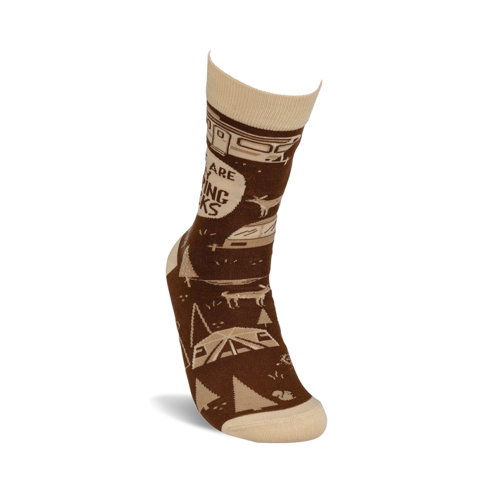 Lifestyle shot of a person wearing one 'These Are My Camping Socks' sock, showcasing the design and fit.