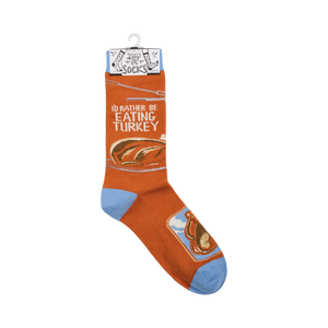 A pair of orange socks with the words 