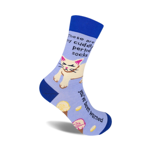 Crew socks in blue and lavender featuring a grumpy cat graphic and the text 'These are my cuddly period socks. You've been warned.'