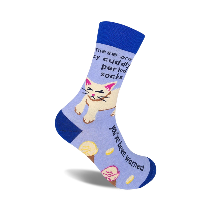 Crew socks in blue and lavender featuring a grumpy cat graphic and the text 'These are my cuddly period socks. You've been warned.'