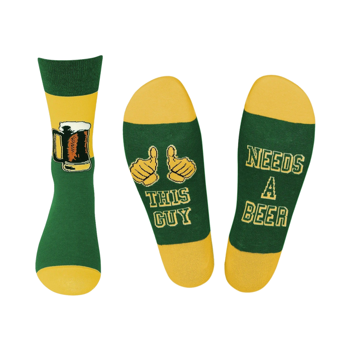 Crew socks in green and gold. One sock shows a beer mug, the other says 'This Guy Needs A Beer'.