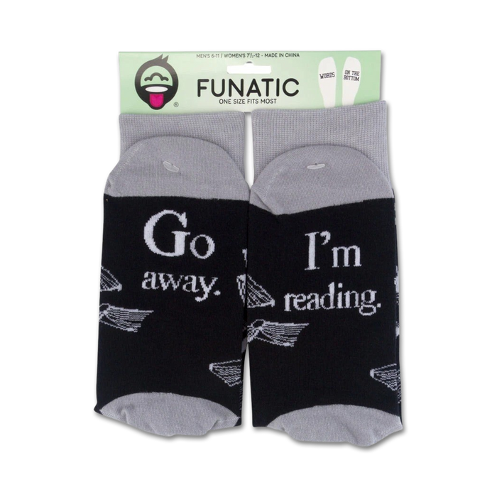 Product packaging of 'Go Away I'm Reading' socks showing the full design on both socks.