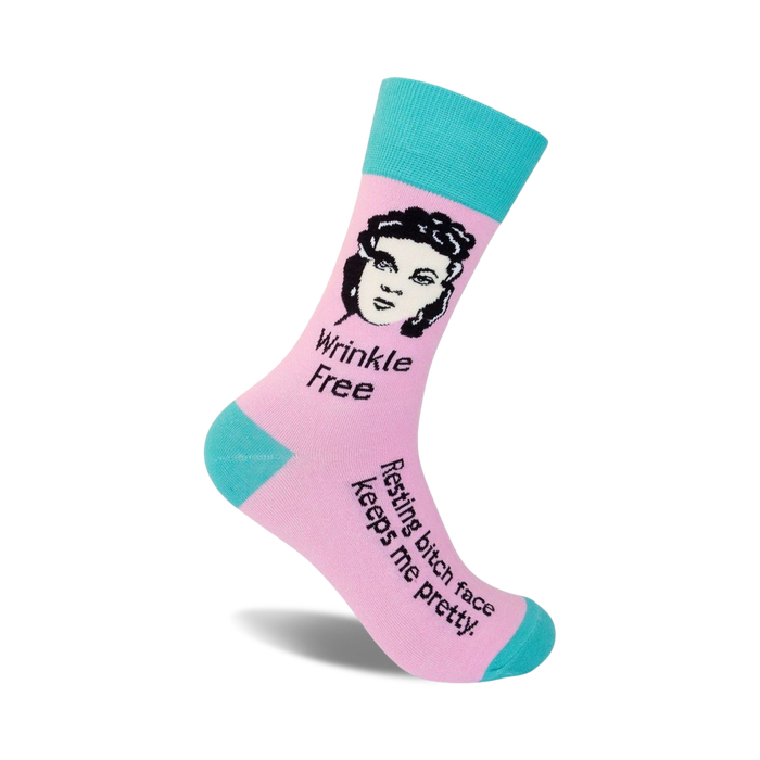 Pink and teal crew socks with a black and white illustration of a woman and the text 'Wrinkle Free' and 'Resting bitch face keeps me pretty'.