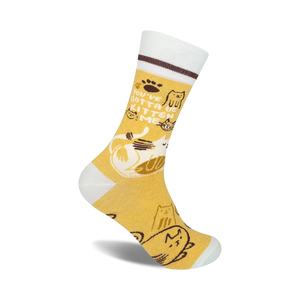 Crew socks in mustard yellow and white, featuring a playful cat design and the text 'You've Gotta Be Kitten Me'.