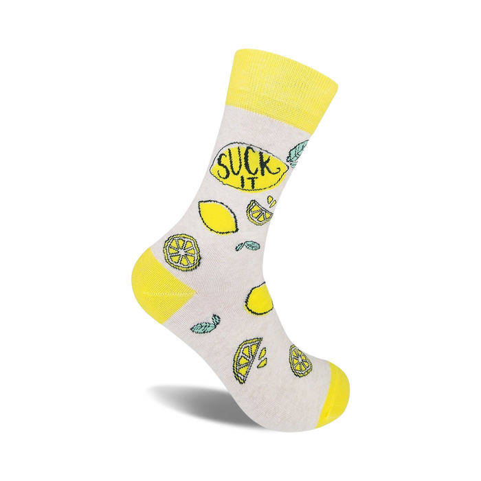 Cream crew socks with a yellow cuff, featuring lemons and the phrase 'Suck It' in a playful design.
