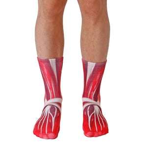 Pair of crew socks showcasing a detailed red and white anatomical muscle design.